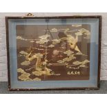 A framed Chinese wheat straw picture depicting a dragon and a phoenix.