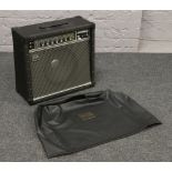 A Roland Jazz Chorus - 50 amplifier in black vinyl covered case with associated cover.