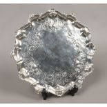 A George III silver salver raised on three step feet, assayed London 1762 by Richard Rugg, 704