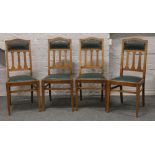 A set of four Edwardian slat back dining chairs raised on square cut tapering legs