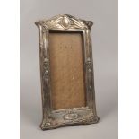 An Art Nouveau silver mounted oak photograph frame assayed Birmingham 1908.Condition report intended