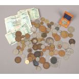 A box of English, foreign coins and Scottish bank notes, along with a Great War medal and a boxed