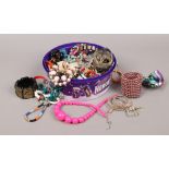 A box of costume jewellery to include beads, bangles, earrings etc.