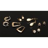 Six pairs of 9ct gold earrings including white paste set examples.