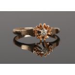A rose gold and diamond solitaire ring in flower head setting, stone approximately 0.64ct size O1/