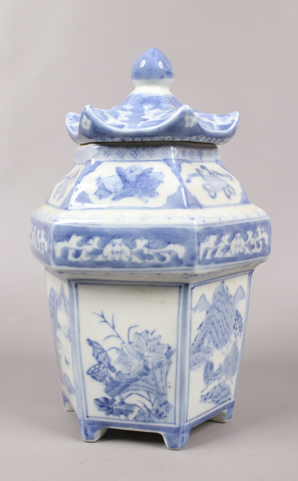A Chinese blue and white hexagonal pagoda shaped tea jar and cover.