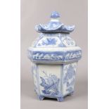 A Chinese blue and white hexagonal pagoda shaped tea jar and cover.