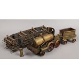A 3" gauge brass live steam powered locomotive and tender complete with a selection of circular