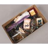 A box of costume jewellery beads, brooches, earrings etc,