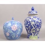 Two decorative vases including a Chinese blue ground baluster example decorated with cherry