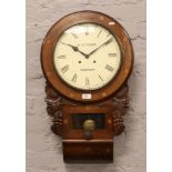A carved mahogany drop dial wall clock with Roman numeral markers stencilled A. Stinson Worksop to