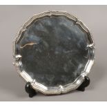 An Edwardian silver card tray with gadrooned decoration assayed London 1901, total weight 360 grams,