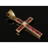 An 18ct gold ruby and diamond set crucifix.