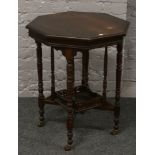 A Victorian mahogany window table raised on turned supports.