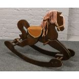 A wooden rocking horse (83cm x 104cm)