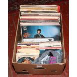 A box of L.P records and singles to include Cliff Richard, Jim Reeves, Shadows etc.