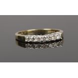 A 9ct gold diamond 7 stone set ring, size P.