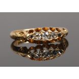 An 18ct gold five stone diamond ring in boat shaped setting, size L, gross weight 2.5 grams.