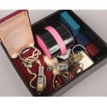 A box of costume jewellery to include simulated pearls, brooches, watches, bracelets etc.