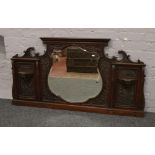 A Victorian mahogany over mantle mirror with bevel edge glass.