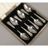 A cased set of 6 Georgian bright cut silver tea spoons, assayed 1797 by George Burrows, 60 grams.