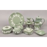 A quantity of green Wedgwood Jasperware including coffee pot, milk jug, trinket boxes, vases etc.