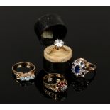 Four 9ct gold dress rings set with white and coloured paste stones