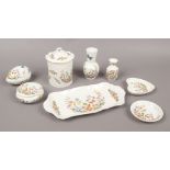 A quantity of Aynsley bone china in The Cottage Garden design including trinket dishes and vases