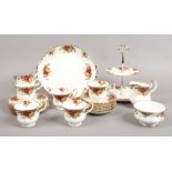 A Royal Albert six plate tea service with cake stand decorated in the Old Country Roses design, 22