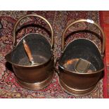 Two brass helmet shaped coal scuttles with shovels.