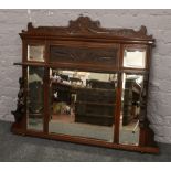A Victorian carved mahogany over mantle mirror.Condition report intended as a guide only.One shelf