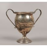 A silver presentation cup with twin handles, assayed Birmingham 1913