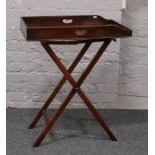 A 19th century mahogany butlers tray on stand.Condition report intended as a guide only.Some