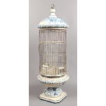 A Spanish blue and white ceramic bird cage.