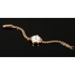 A ladies 9ct gold manual watch head on 9ct gold bracelet strap, gross weight 13.75 grams.