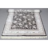 A grey ground woven bamboo silk rug decorated with a traditional hunting scene, 160cm x 235cm.