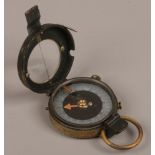 A World War I Verniers patent brass compass with mother of pearl dial.