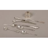 A collection of silver items to include button hook, glove stretchers, page turner, spoons,