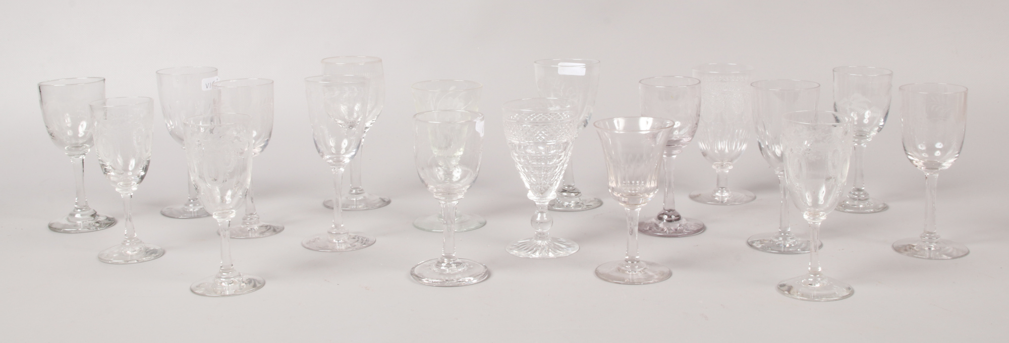 A collection of various drinking glasses to include etched Victorian examples.