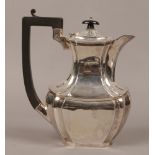 A George V silver coffee pot, assayed Birmingham 1927 by William Adams, gross weight 594 grams.