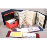 Three albums of world stamps, along with two albums of Mint Jersey stamps and a case of Royal Mail