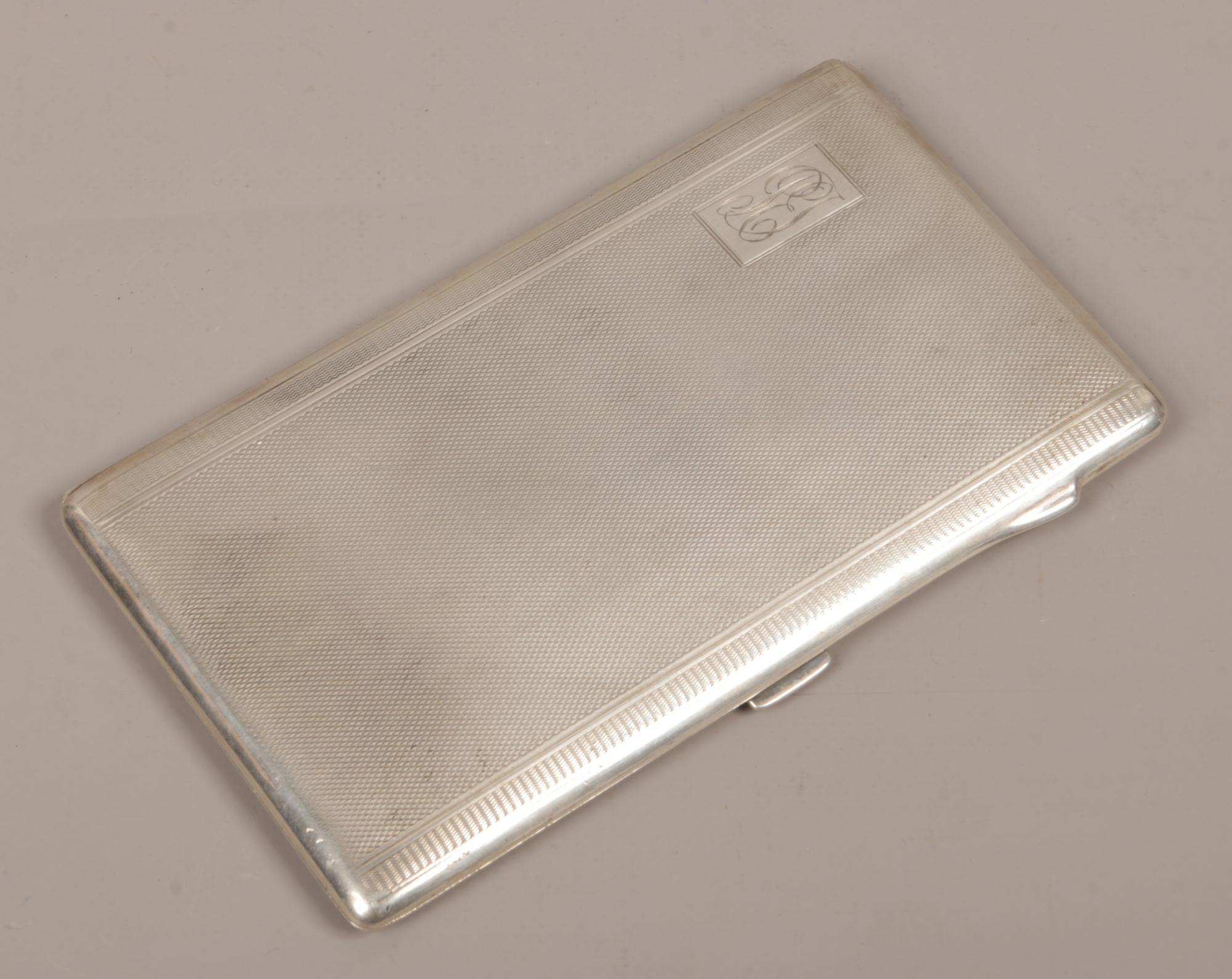 A George V silver cigarette case assayed Birmingham 1919 by Joseph Gloster Ltd, 198 grams.