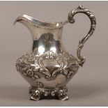 A Victorian silver cream jug with gilt lining assayed London 1842 by William Hunter, 164 grams.