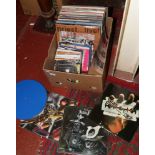 A box of L.P and single records to include pop, rock and metal, Motorhead, Saxon, Judas Priest etc.