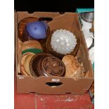 A box of miscellaneous to include commemorative carved wooden dishes, coloured glass etc.