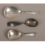 Two silver caddy spoons and a medicine spoon.