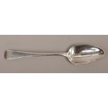 A Georgian silver table spoon, assayed London 1801 by Solomon Hougham, 58 grams.