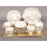 A Rockingham style early 19th century teaset with gilt decoration, approximately 27 pieces. Possibly