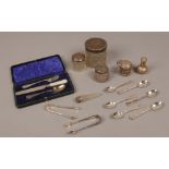 A collection of silver items to include flatware, mustard pot, silver top jars etc.