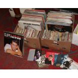 Two boxes of L.P records and singles to include a quantity of Cliff Richard, Jason Donovan, Billy